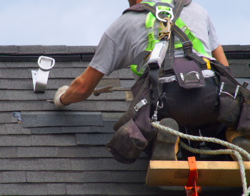 Franklin roofer securing shingles before storm season